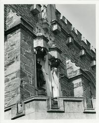 Students pretending to be statues on top of Thomas Great Hall main entrance