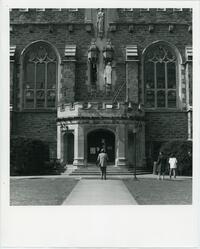 Students pretending to be statues on top of Thomas Great Hall main entrance