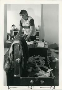 Woman and costume trunk