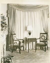 The Lunts at home, 150 East End Avenue : view of bedroom window, featuring table, lamp, and chairs with embroidered upholstery