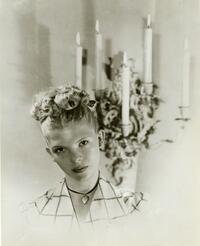 Publicity portrait of Bambi Linn, with sconce