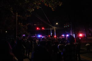 Student marchers at blockade of police cruisers 5