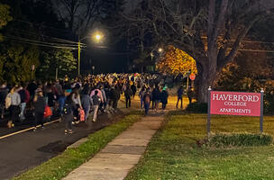 Student Marchers Pass Haverford College Sign