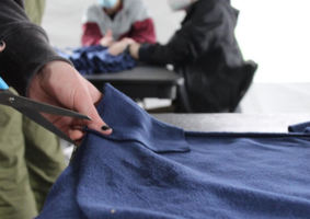 Close-up of cutting fabric photograph