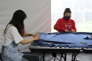 Two students working on blanket ties photograph