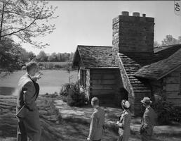 Student tour guide Robert Ives points to the Duck Pond