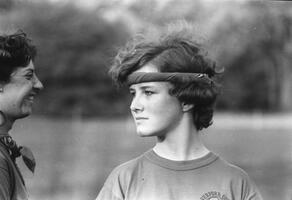 Soccer player listening to her coach