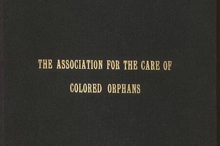 Black front cover of a book with the title in gold text "The Association for the Care of Colored Orphans"