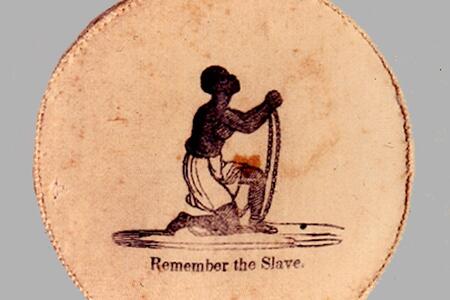 Button depicting a slave in chains on their knees with the text "Remember the Slave" 