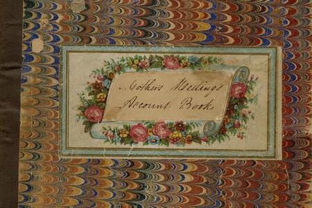 Book cover with a colorful pattern and the text "Mothers Meetings Account Book" on a wreath
